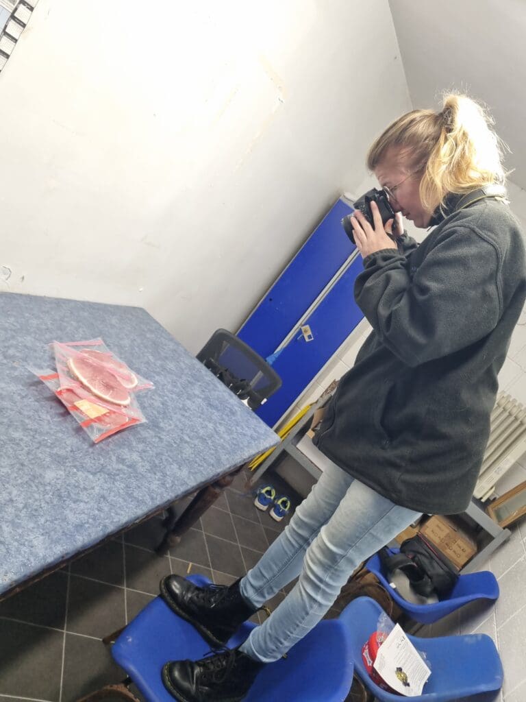 Jamie-Lee precariously taking photos